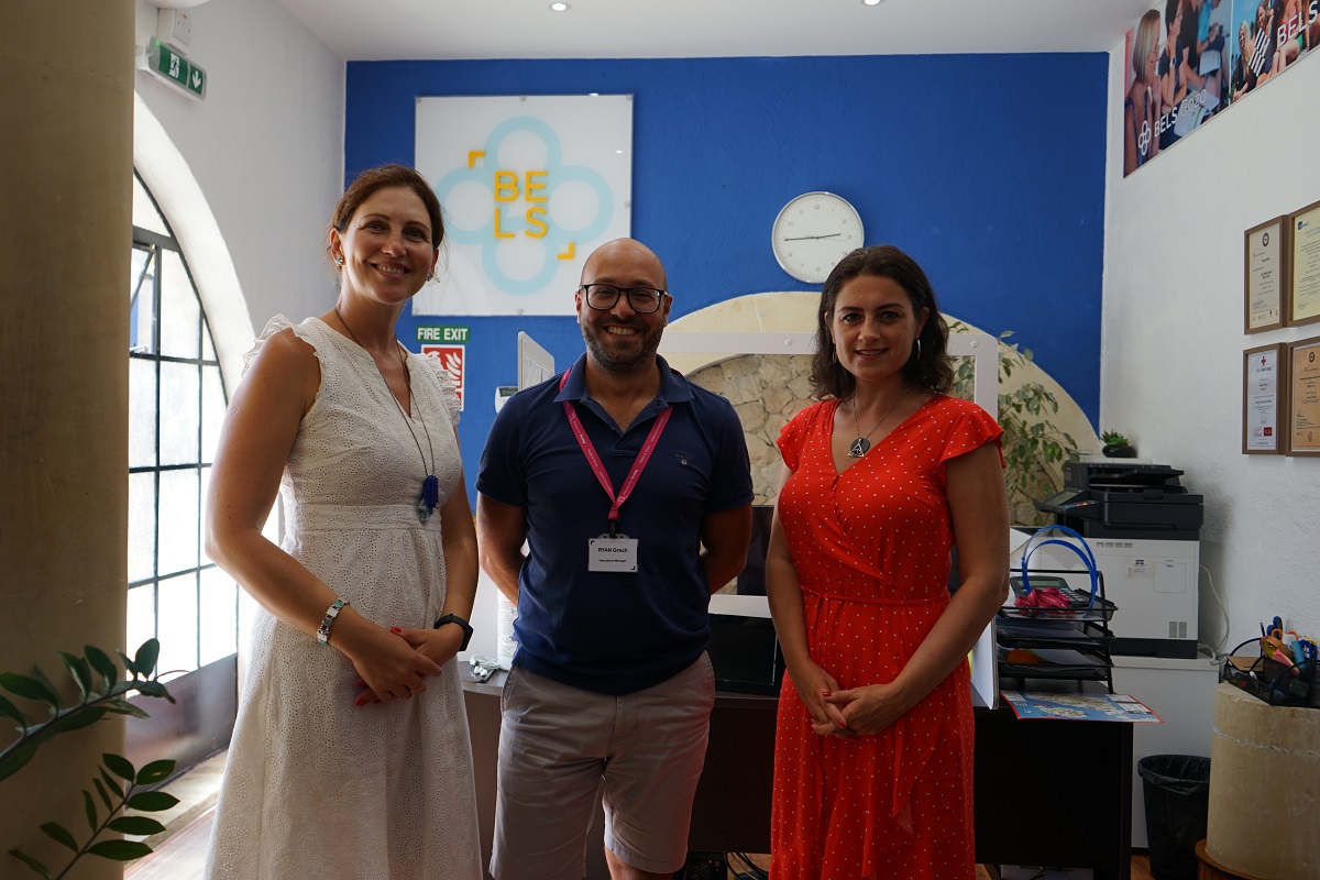 Two BELS Gozo students with the manager in the reception